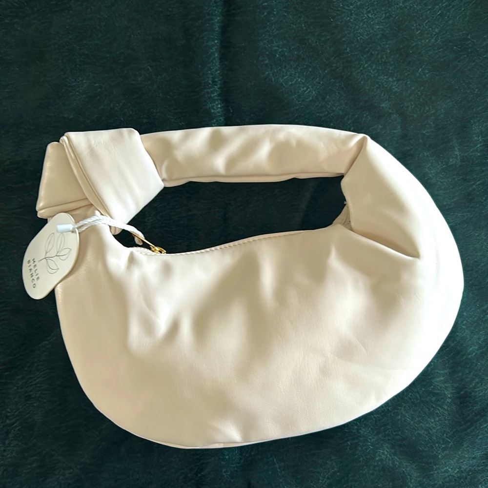 Clutch bag, cream color. New with tags.